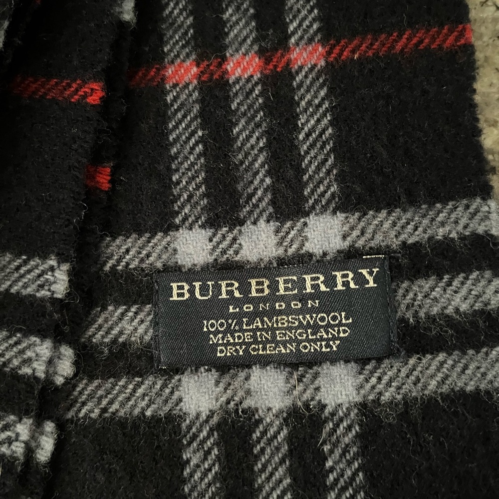 Authentic Burberry lambswool scarf. Colors are dark navy, gray and red. EUC!!